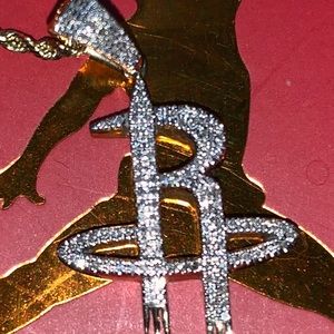 14kt custom rockets pendant with 0.78 ct diamonds